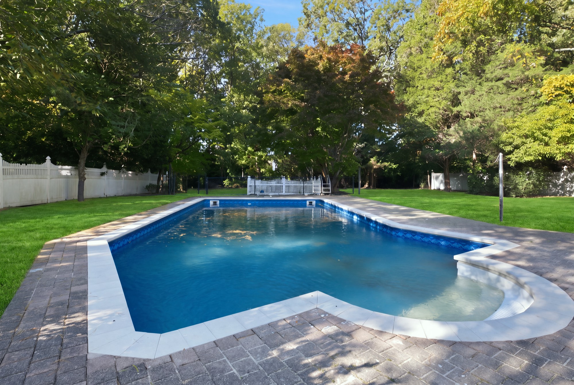 In-ground pool with new pavers